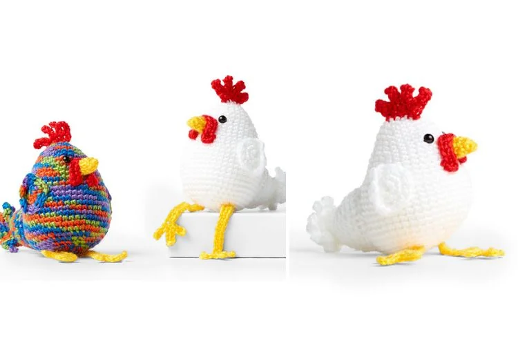 Three crocheted chickens on a white background.