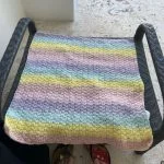 a multicolored crochet baby blanket