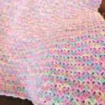 a colorful crochet baby blanket