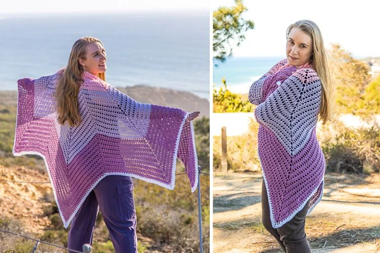 A woman standing outside with a crochet shawl.