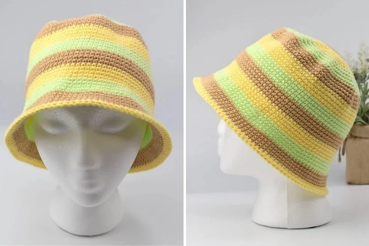 A mannequin wearing a yellow and green striped hat.