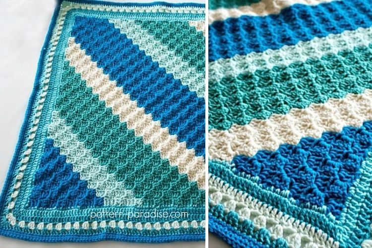 A blue and white crocheted afghan.