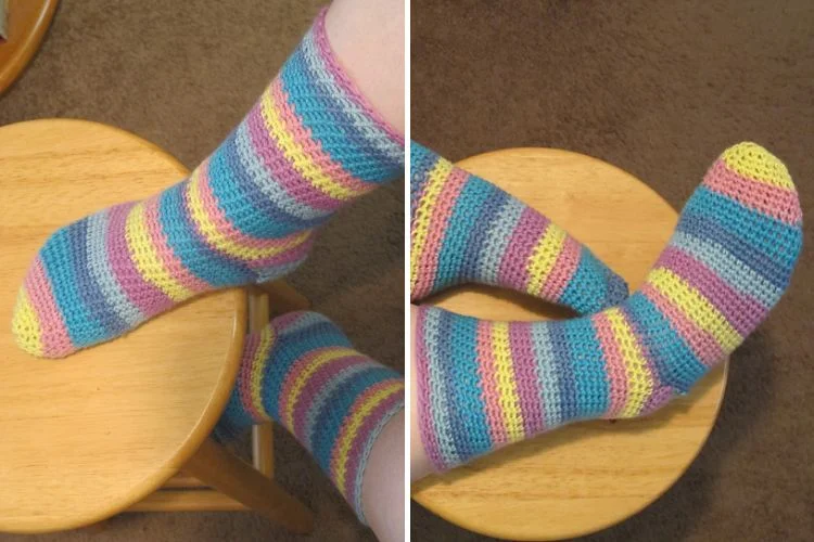 A pair of feet wearing colorful socks.