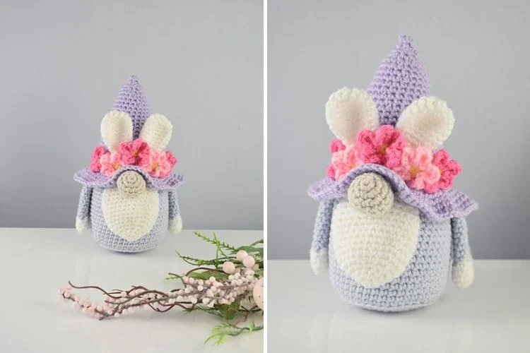 A crocheted bunny with flowers on his head.