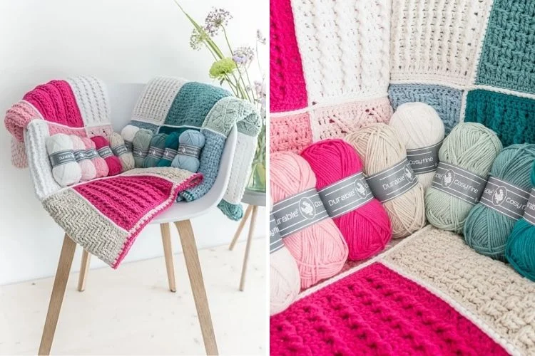 A crocheted blanket with different colors of yarn on a chair.