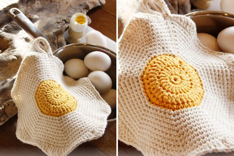 A crocheted egg pot holder is next to a pot of eggs.