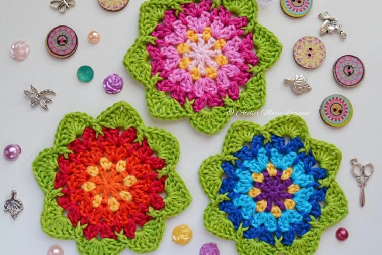 Three crocheted flower coasters surrounded by buttons.