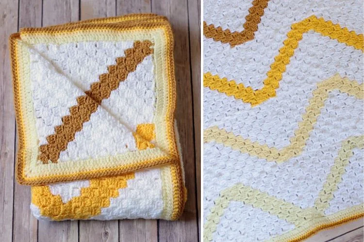 Handmade crocheted blanket with chevron pattern in white, yellow, and brown colors.