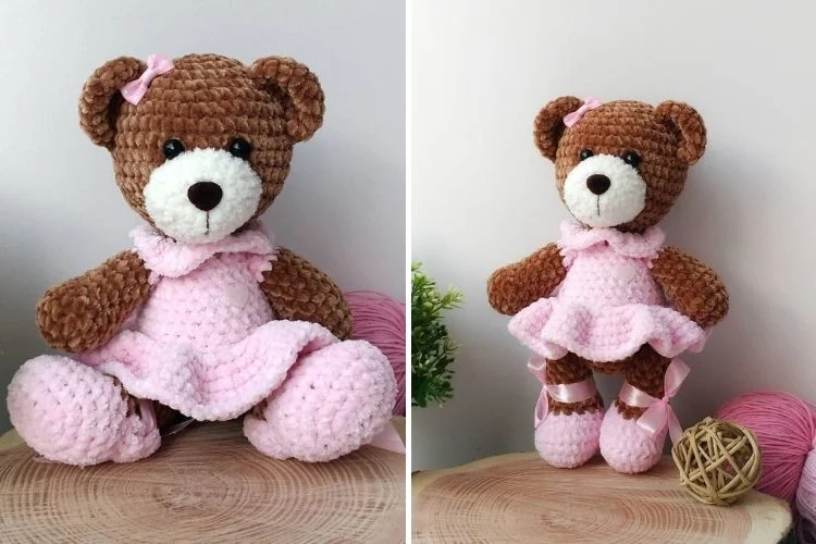 Two handmade crochet teddy bears in pink dresses on a wooden surface.