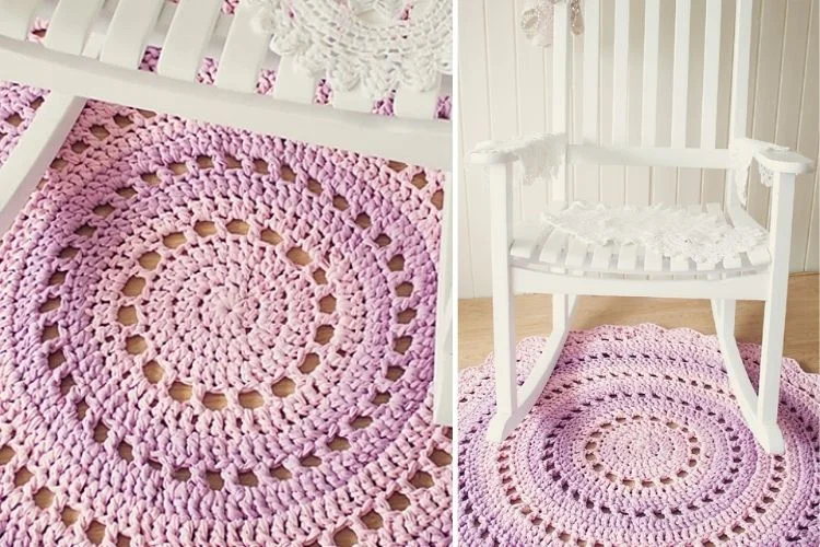 Handcrafted pink crochet rug placed on a wooden floor beside a white wooden chair.