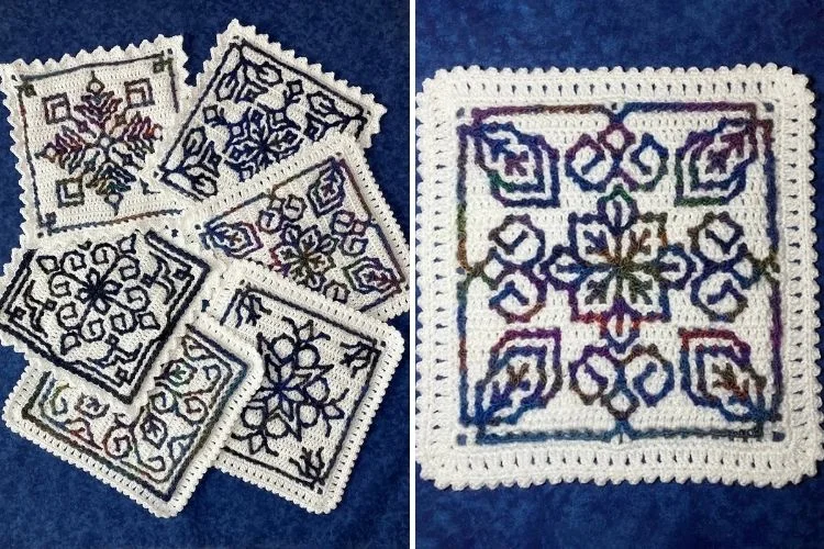 A collection of handmade cross-stitch embroidery pieces with symmetrical floral designs, displayed on a blue background.