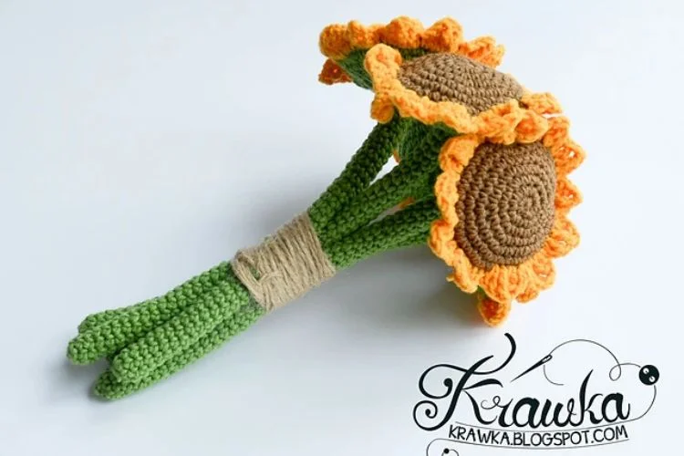 Handcrafted crochet sunflower bouquet on a white background.