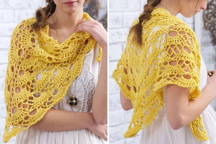 A woman wearing a yellow crochet shawl over a white dress.