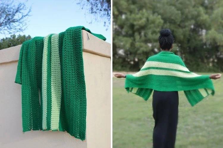 A green and white striped knitted shawl displayed over a wall and worn by a woman with a bun, arms extended, in a natural setting.