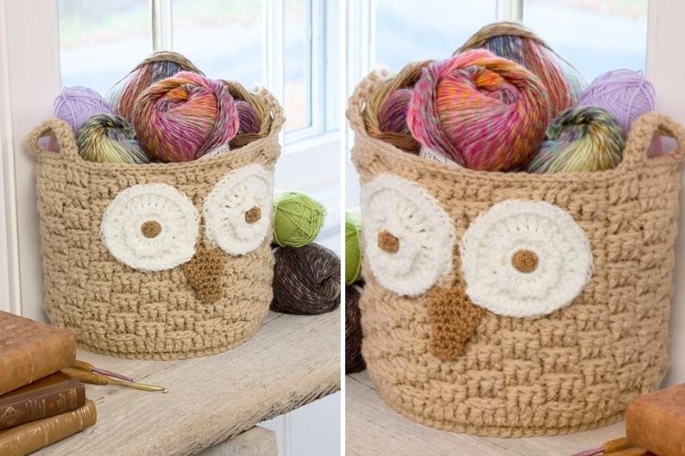 A crocheted basket with an owl face design, filled with colorful yarn balls, placed on a wooden surface near a window.