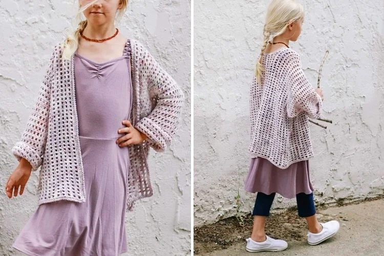 a little girl wearing a mesh crochet cardigan