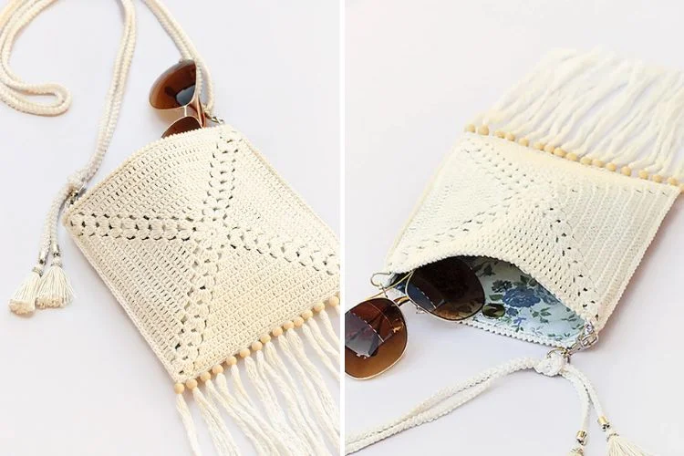 a small ecru crochet bag with tassels