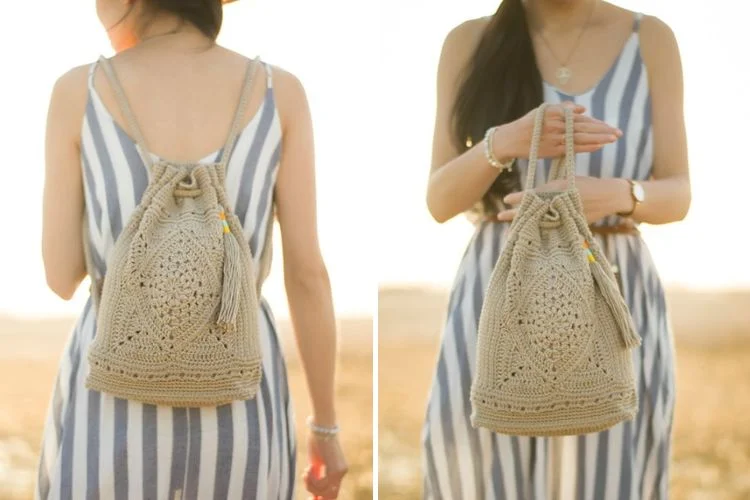 a woman holding a crochet backpack in a neutral color