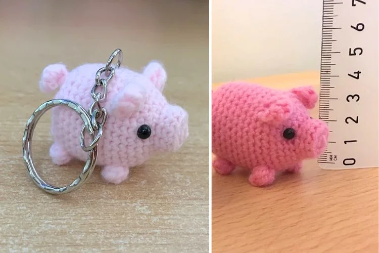 Handmade pink crocheted pig keychain and a separate crocheted pig next to a ruler showing its size.