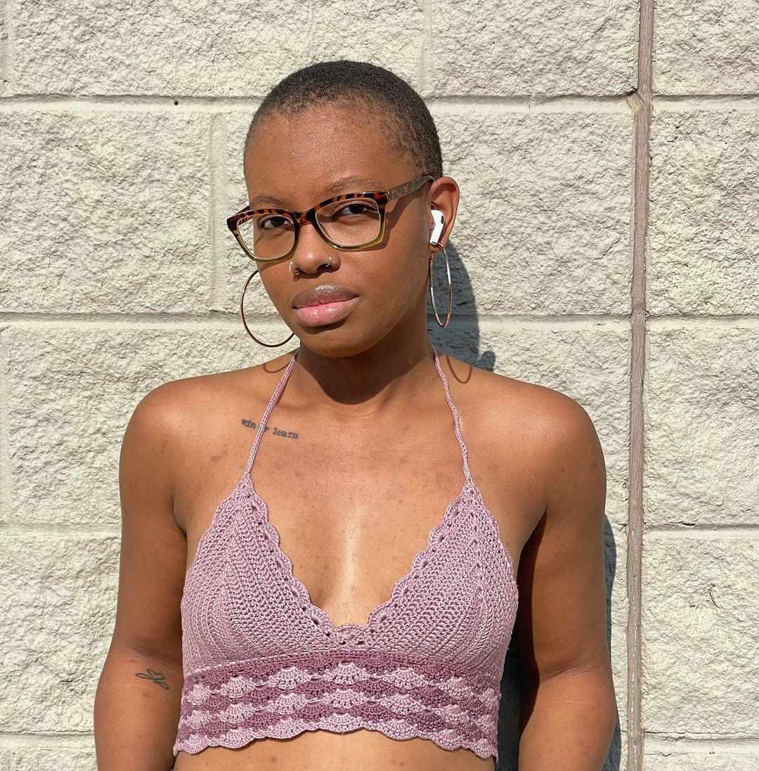 woman wearing lavender color crochet crop top