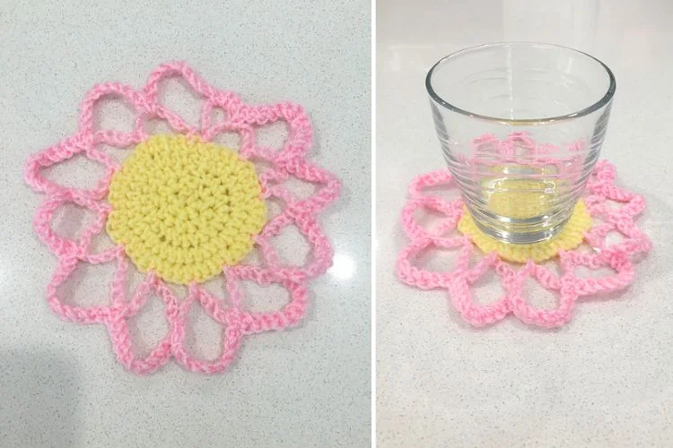 A handmade crochet coaster designed to look like a flower, shown both alone and with a glass placed on it.