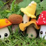 a collection of mushroom crochet amigurumi