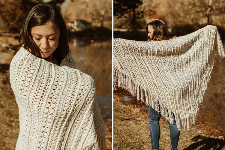 a woman wearing a big crochet shawl with tassels