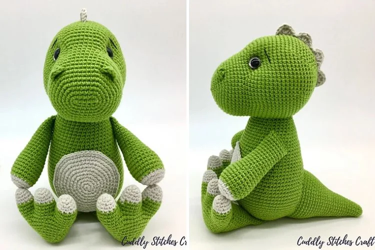 a green crocheted dinosaur amigurumi