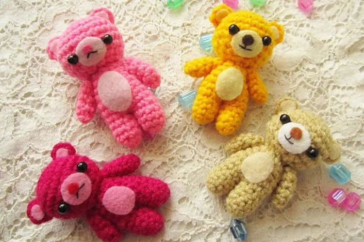 a set of small bear amigurumi in different colors