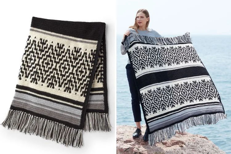 a crochet blanket with a nordic design in black and white