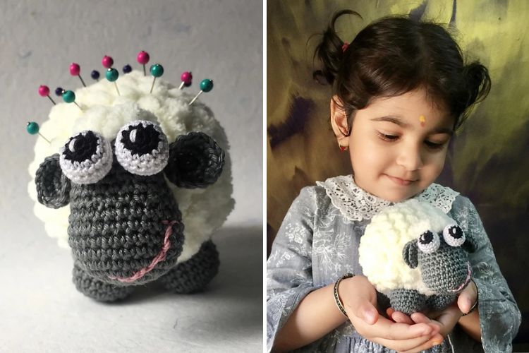 a crochet pin cushion shaped like a sheep