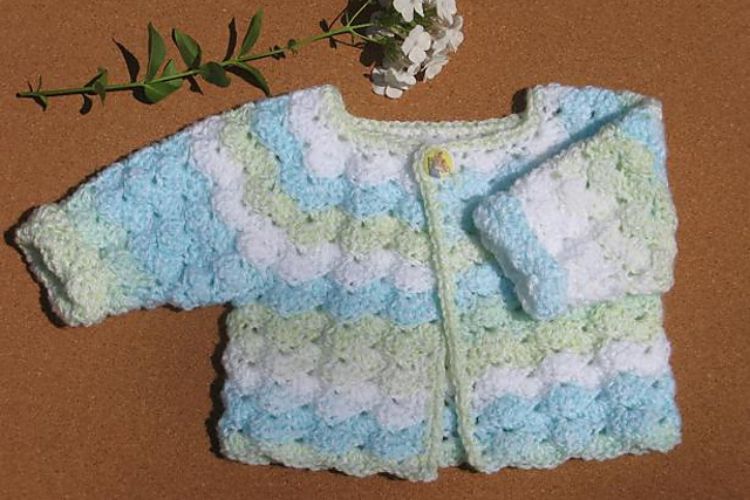 a crochet baby cardigan