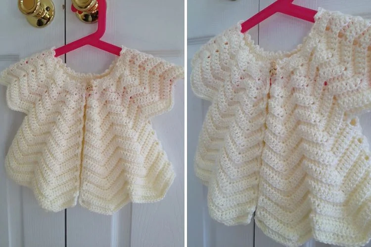 a crochet baby cardigan in a cream color