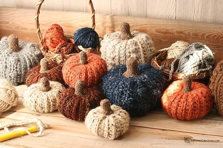 a collection of crochet pumpkins