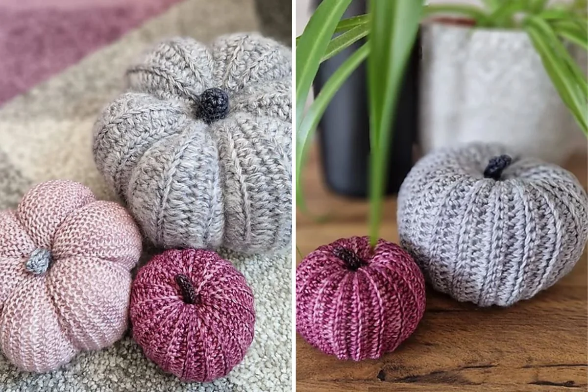 Three crochet pumpkins in gray, pink, and purple are artfully displayed on a rustic surface with a lush plant nearby, creating an inviting autumn ambiance.