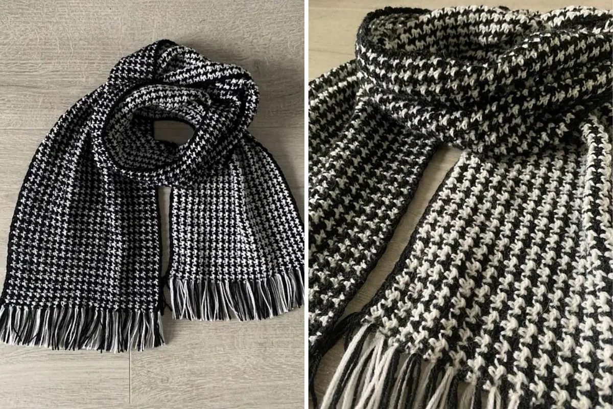 A fringed houndstooth crochet scarf in classic black and white elegantly sprawls across a wooden surface, captured from two different angles.