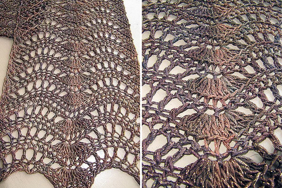 Close-up of a crochet scarf showcasing an intricate Feather and Fan lace pattern in a wavy design, highlighted by elegant brown and bronze tones.