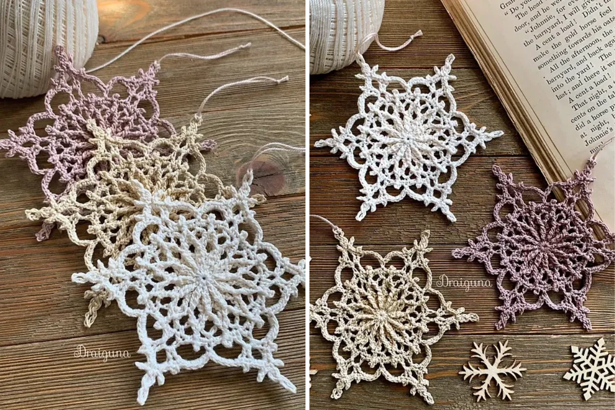 Crocheted snowflake ornaments in beige, white, and purple are artfully displayed on a wooden surface with a book and crochet supplies nearby, evoking the charm of traditional Christmas Goat decorations.