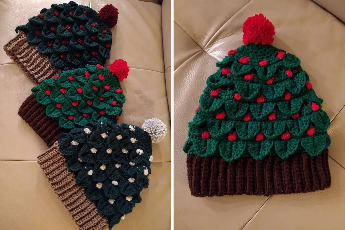 Four crochet hats featuring festive Xmas tree designs and topped with cheerful pom-poms rest on a beige surface, perfect for the holiday season.