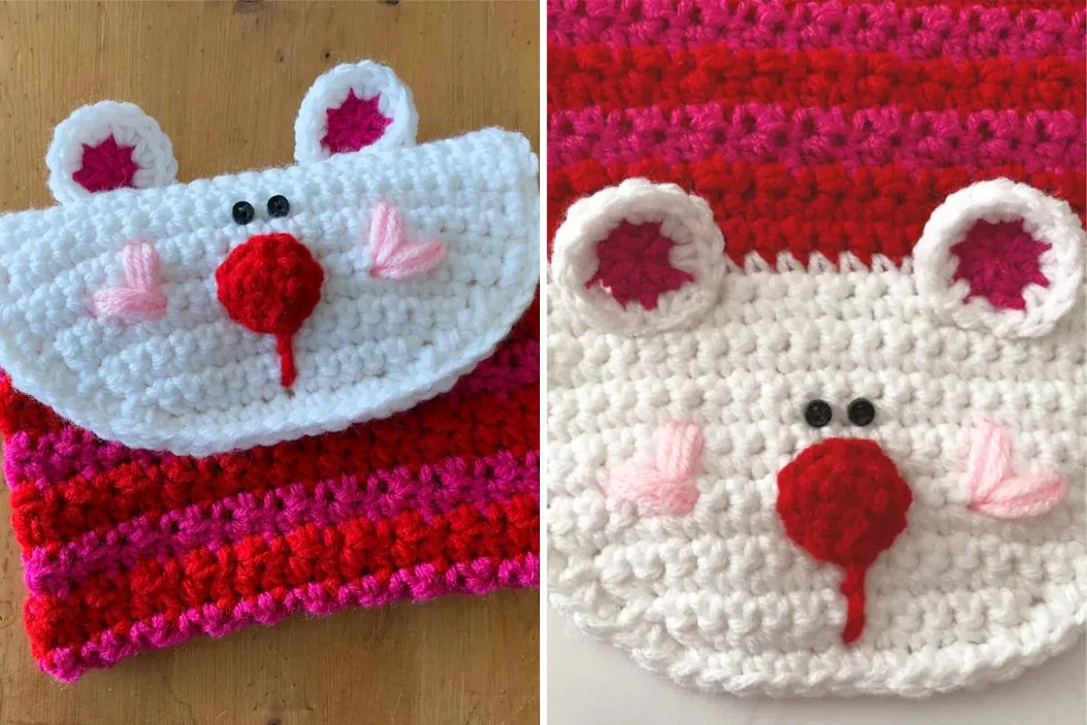 Crocheted pouch with a bear face design, featuring a red nose, black eyes, and pink ears. The pouch has red and pink stripes.