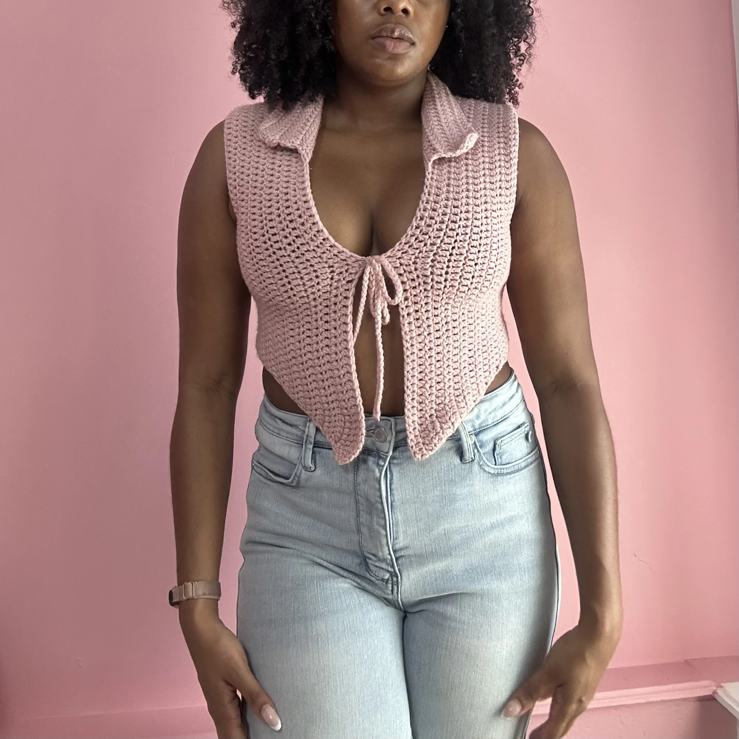 woman wearing tie front crochet top in pink color