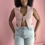 woman wearing pink crochet top with tie front