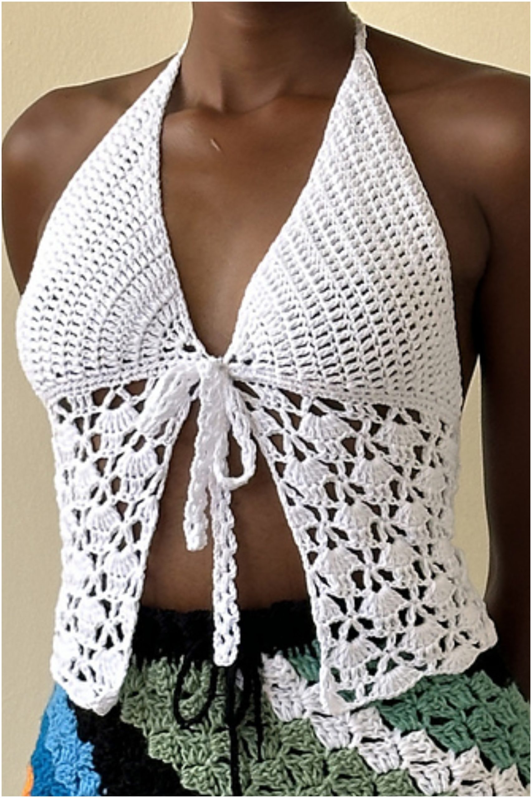 Women wearing a white front-tie crocheted butterfly top