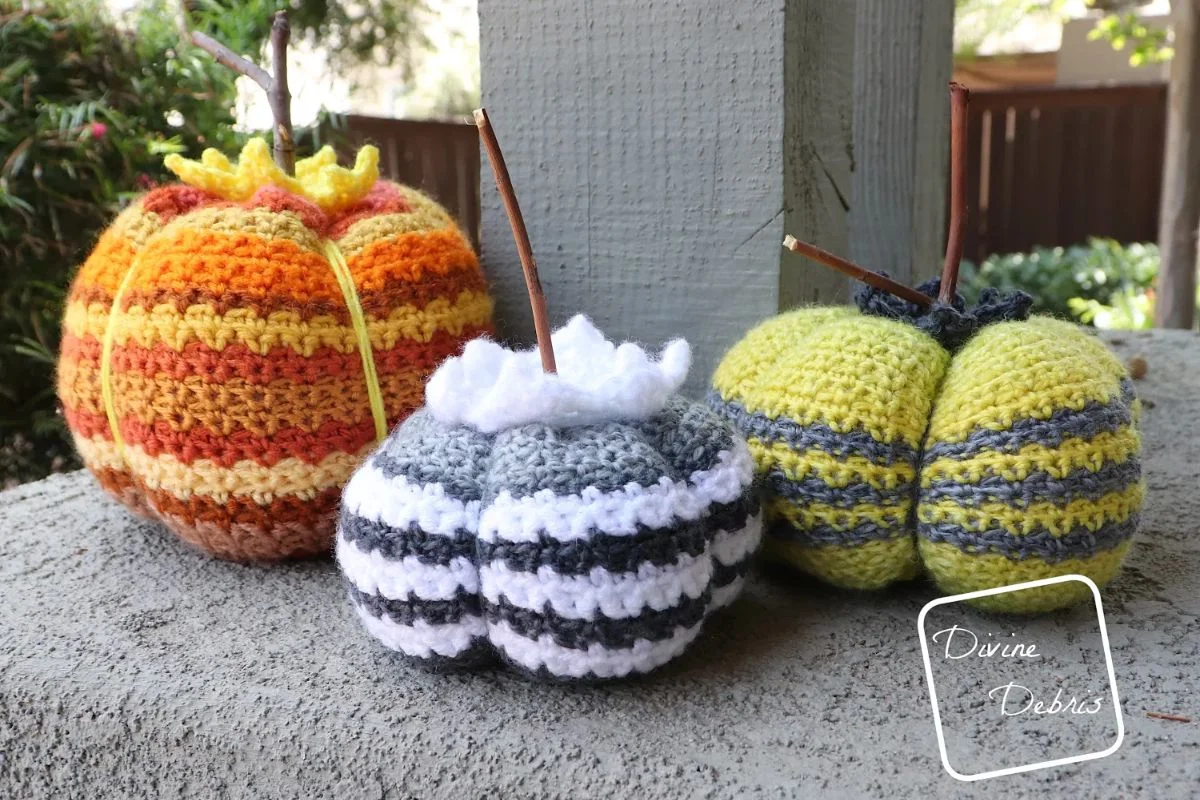 crochet pumpkins featuring colorful striped designs