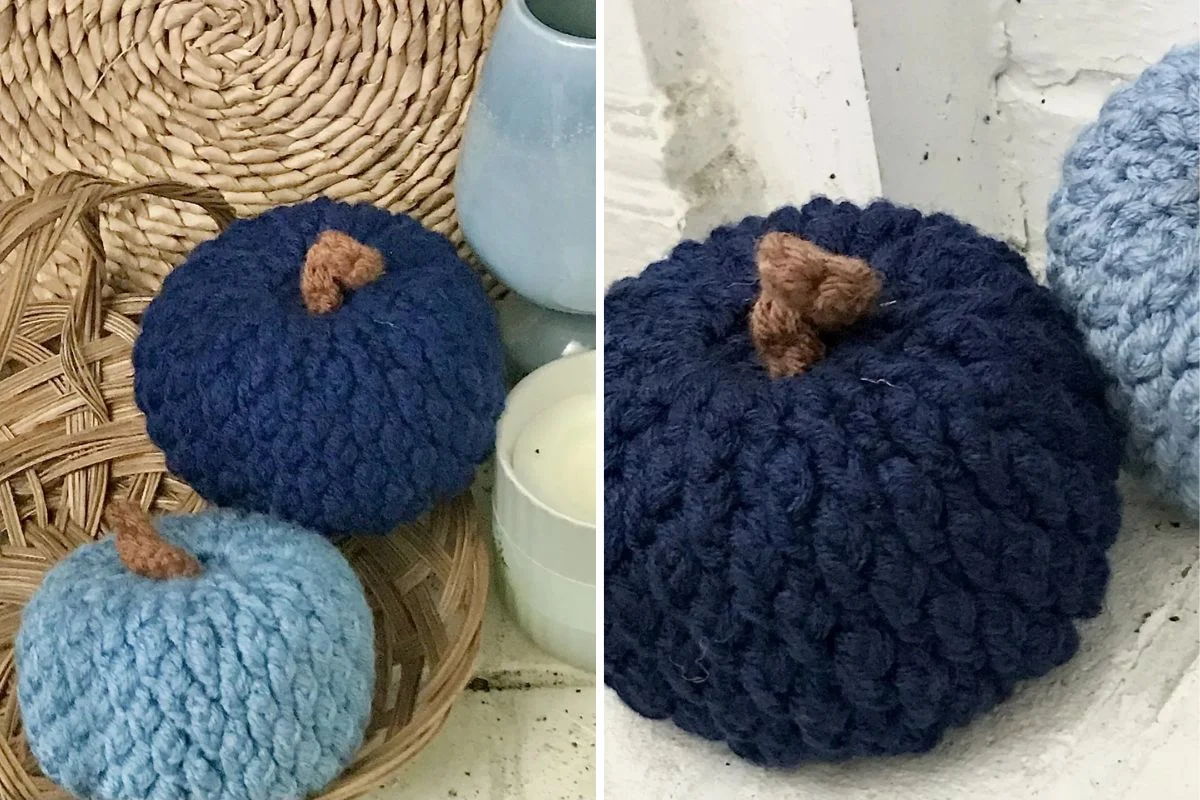 two crocheted pumpkins in light blue and in dark blue