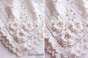 a white crochet baby blanket with a floral design