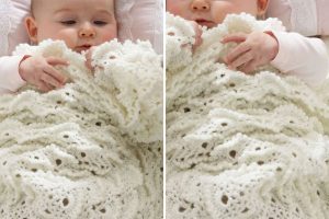 a white crochet baby blanket