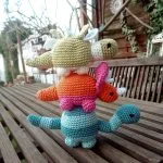 crochet dinosaurs stacked one on another