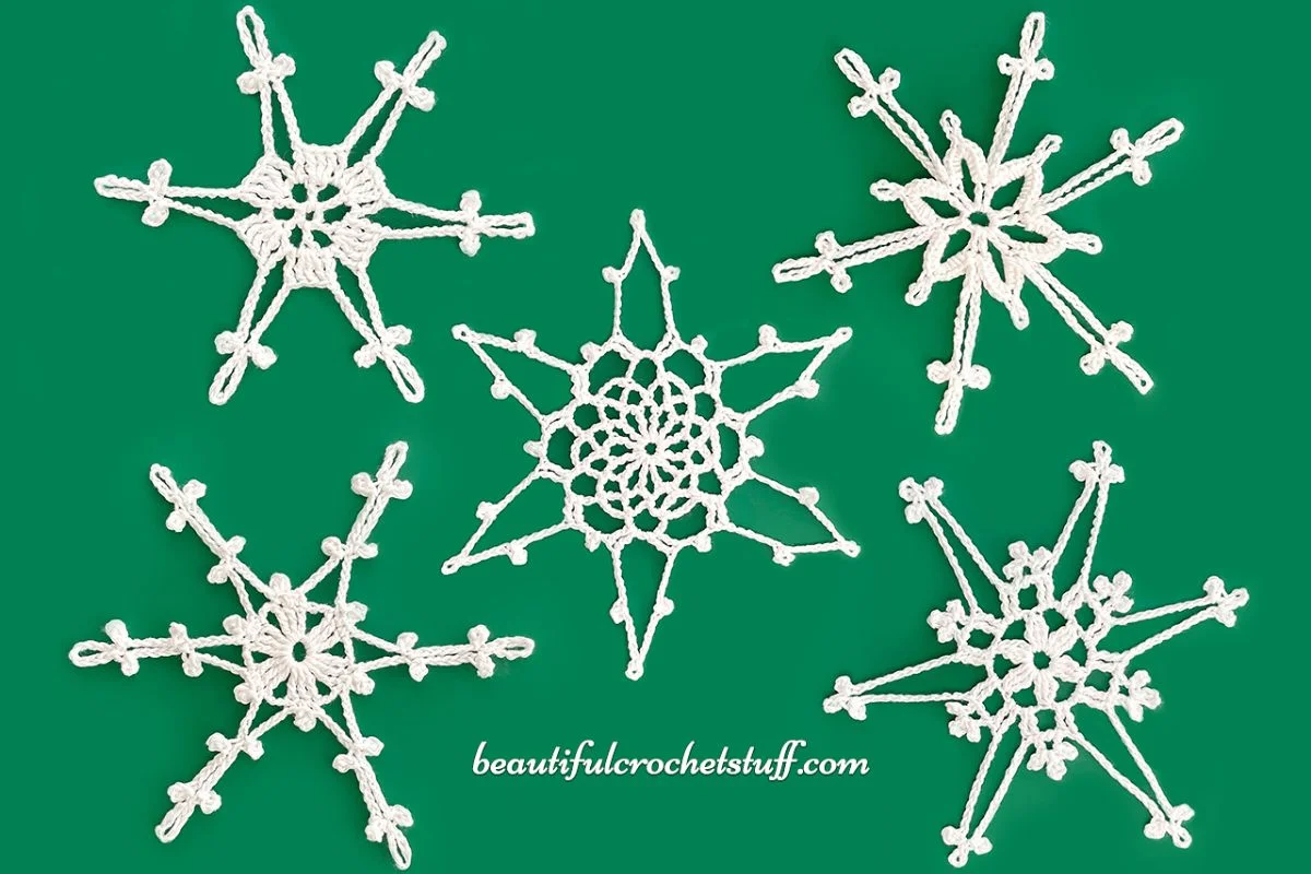 a set of delicate lace crochet snowflake ornaments