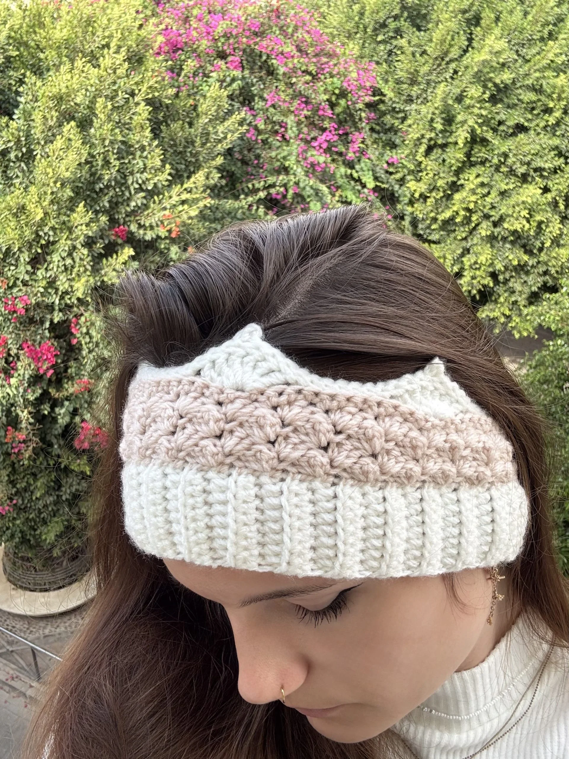 woman weraing white and pink crochet crown headband